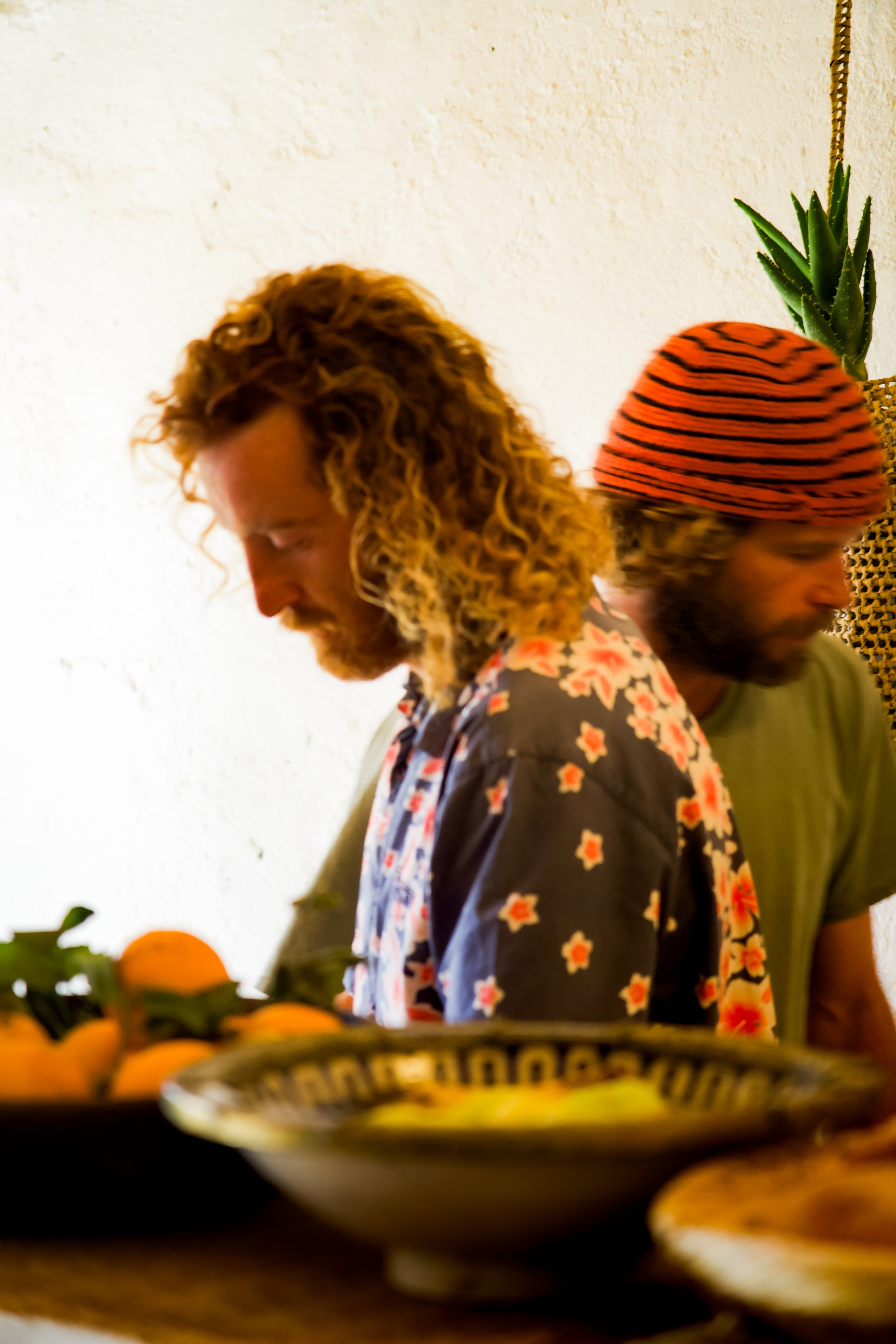Omer and Victor side by side at the kitchen table